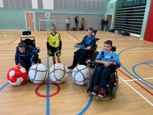 Football For All Participants Posing with their Adapted Equipment